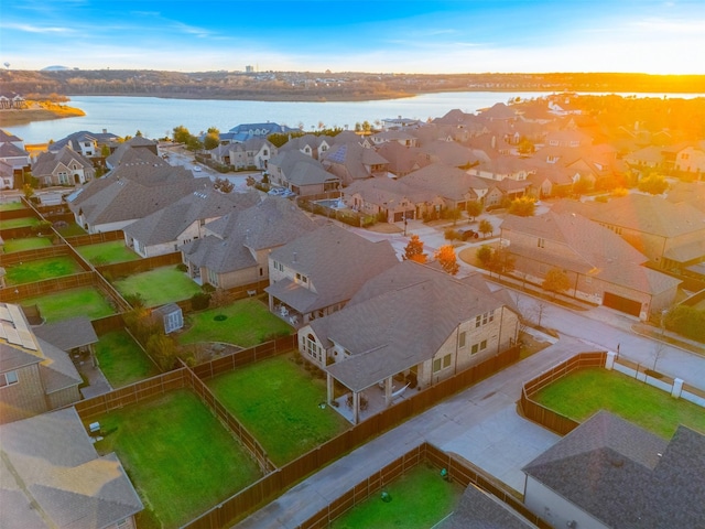 aerial view featuring a water view and a residential view