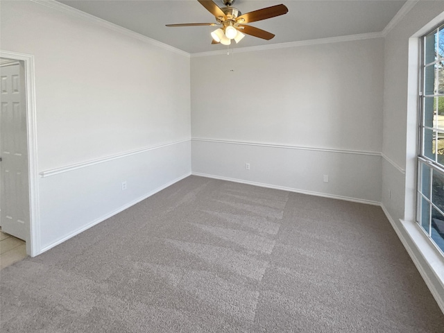 empty room with baseboards, ornamental molding, and light colored carpet