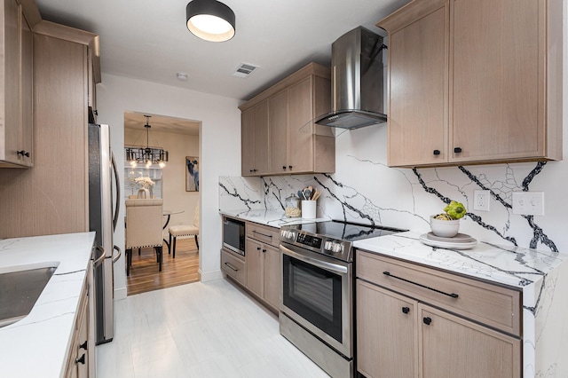 kitchen featuring visible vents, backsplash, light brown cabinetry, appliances with stainless steel finishes, and wall chimney exhaust hood