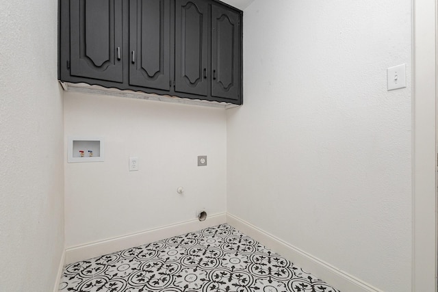 laundry room with cabinet space, baseboards, washer hookup, and electric dryer hookup