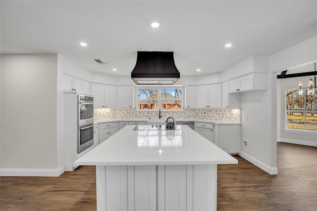 7004 Ledbetter Rd, Arlington, TX 76001 - kitchen with premium range hood, baseboards, appliances with stainless steel finishes, backsplash, and recessed lighting