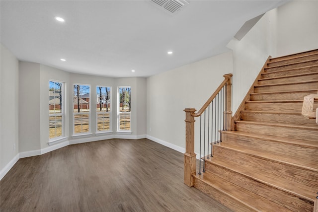 7004 Ledbetter Rd, Arlington, TX 76001 - unfurnished living room featuring baseboards, wood finished floors, recessed lighting, and stairway