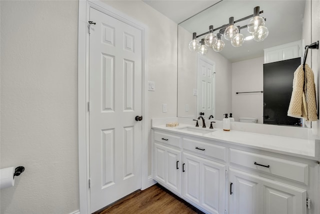 7004 Ledbetter Rd, Arlington, TX 76001 - bathroom featuring vanity and wood finished floors