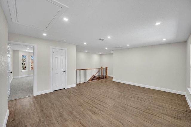 7004 Ledbetter Rd, Arlington, TX 76001 - unfurnished room featuring attic access, wood finished floors, baseboards, and recessed lighting