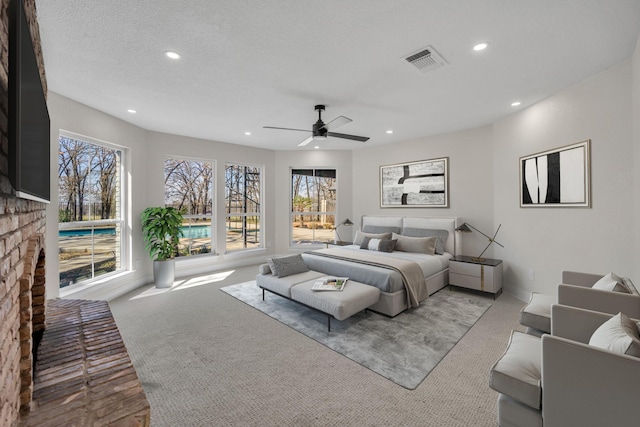7004 Ledbetter Rd, Arlington, TX 76001 - carpeted bedroom with recessed lighting, multiple windows, a brick fireplace, and ceiling fan