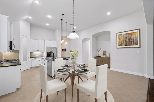 869 Field Xing, Little Elm, TX 76227 - dining room featuring arched walkways, light tile patterned floors, recessed lighting, baseboards, and lofted ceiling
