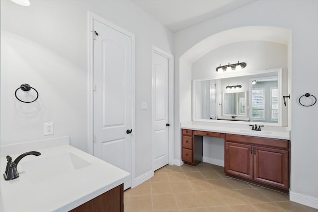 869 Field Xing, Little Elm, TX 76227 - full bathroom featuring two vanities, baseboards, and tile patterned floors