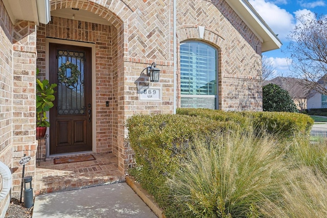 869 Field Xing, Little Elm, TX 76227 - doorway to property with brick siding