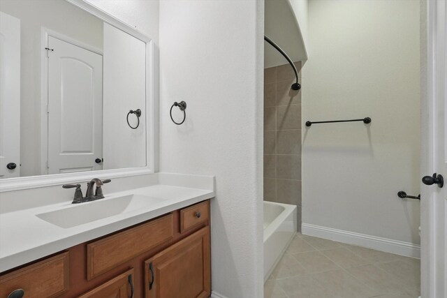 869 Field Xing, Little Elm, TX 76227 - bathroom featuring vanity, baseboards, shower / bath combination, and tile patterned floors