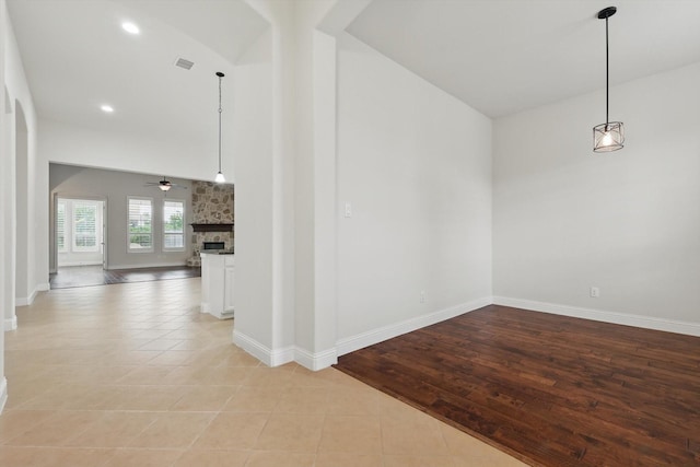 869 Field Xing, Little Elm, TX 76227 - spare room with a fireplace, ceiling fan, baseboards, recessed lighting, and light tile patterned floors