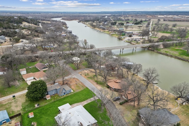 drone / aerial view featuring a water view and a residential view