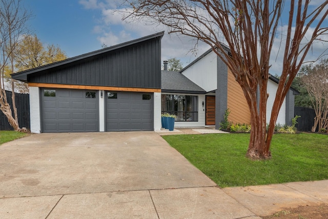 mid-century home featuring a garage, concrete driveway, fence, and a front lawn