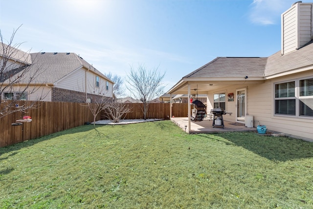 view of yard with a patio and a fenced backyard