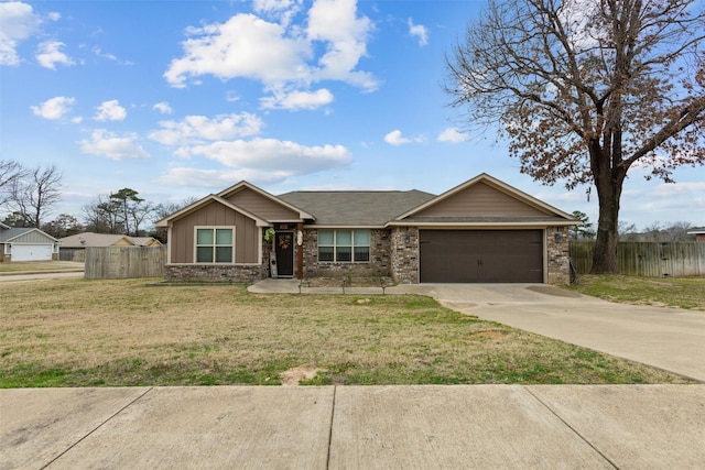 view of front of house with a garage, fence, concrete driveway, and a front yard