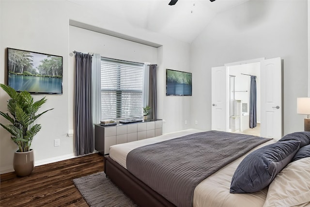 bedroom with lofted ceiling, baseboards, dark wood finished floors, and a ceiling fan