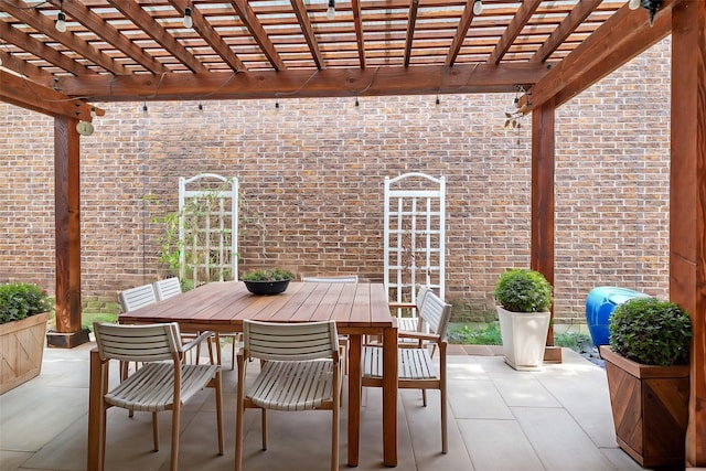 view of patio / terrace with outdoor dining space and a pergola