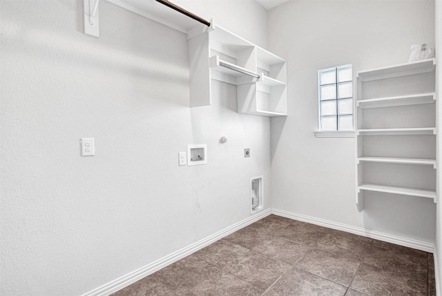 laundry area featuring hookup for a washing machine, hookup for a gas dryer, electric dryer hookup, laundry area, and baseboards