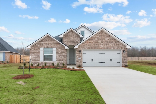 view of front of property featuring an attached garage, brick siding, fence, driveway, and a front lawn