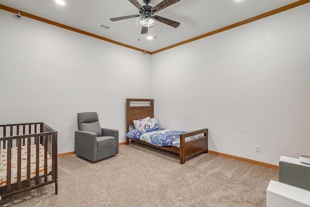 carpeted bedroom with recessed lighting, ceiling fan, baseboards, and ornamental molding