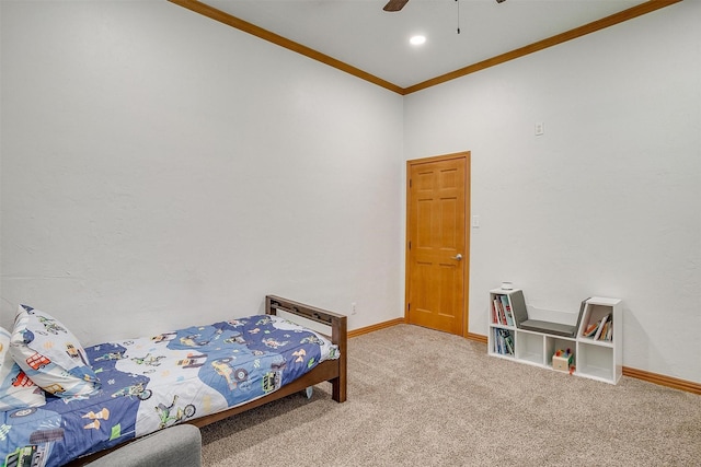 bedroom featuring ornamental molding, carpet flooring, baseboards, and a ceiling fan