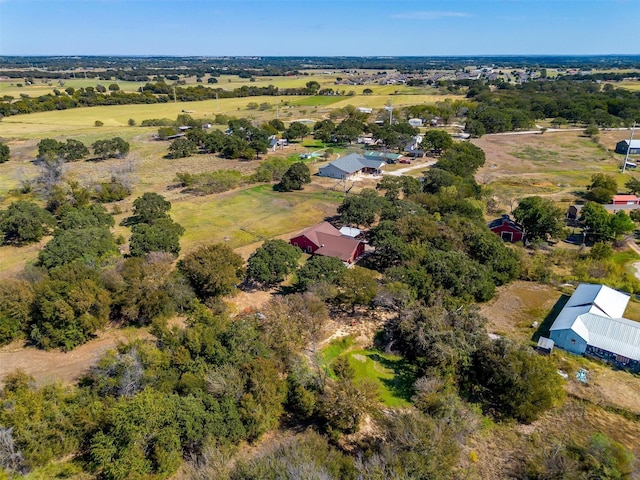 birds eye view of property with a rural view