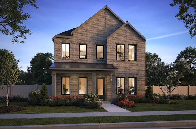 view of front of house with brick siding, a standing seam roof, a front yard, and fence