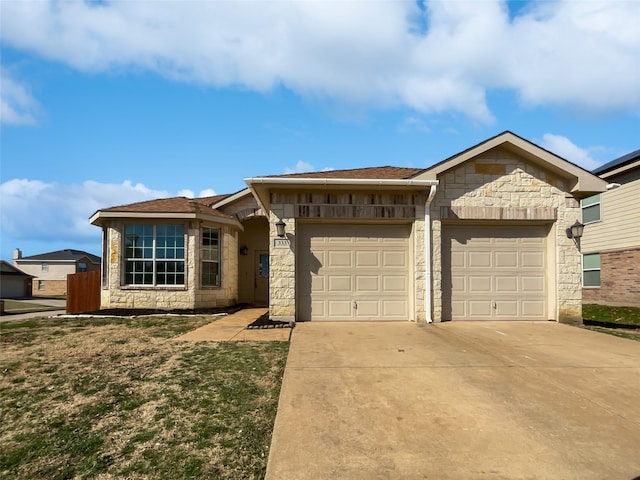 single story home featuring a garage, concrete driveway, and stone siding