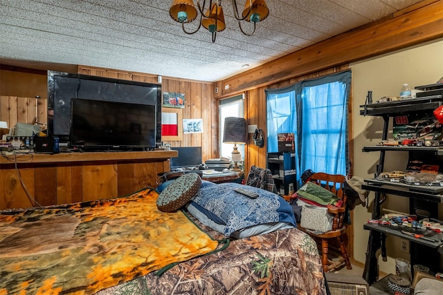 bedroom featuring wooden walls