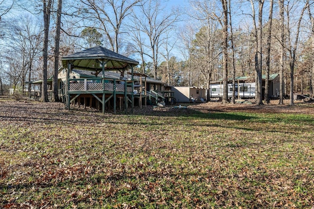 view of yard featuring a gazebo and a wooden deck