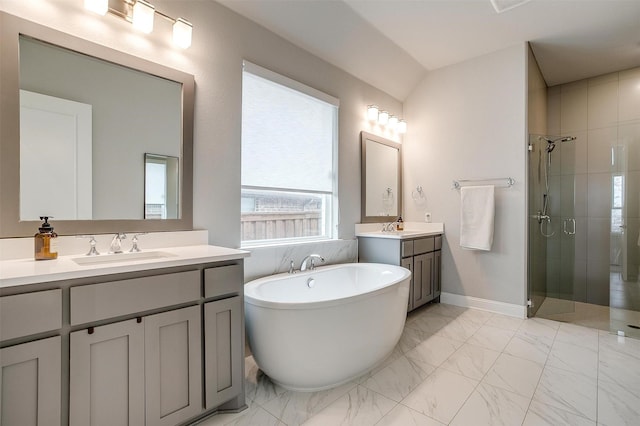 full bath featuring marble finish floor, a stall shower, and a sink