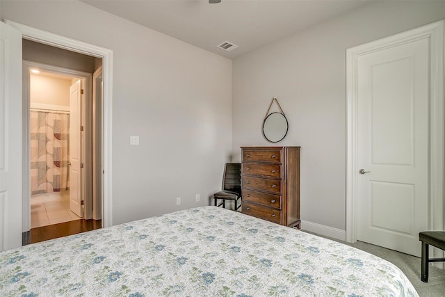 bedroom featuring visible vents