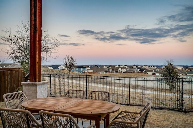 balcony featuring a residential view and outdoor dining area