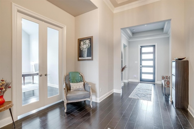 entryway with ornamental molding, french doors, baseboards, and dark wood-style flooring