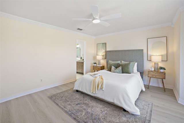 bedroom with visible vents, baseboards, ensuite bathroom, crown molding, and light wood-type flooring