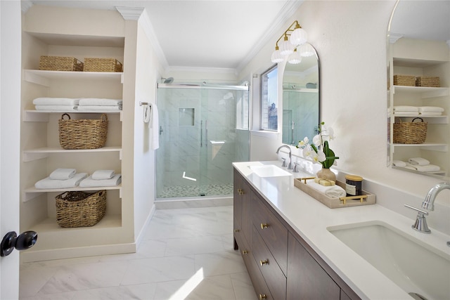 bathroom with marble finish floor, ornamental molding, a sink, and a stall shower