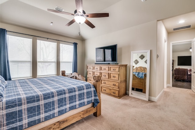 bedroom featuring visible vents, light carpet, baseboards, and ceiling fan