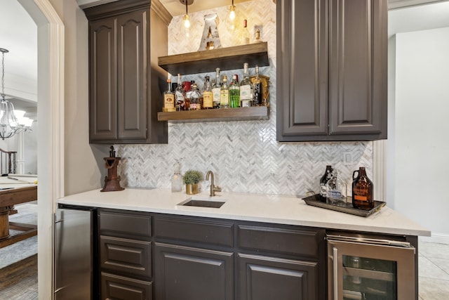 bar with indoor wet bar, wine cooler, backsplash, and a sink