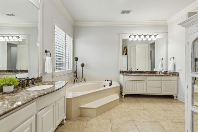 bathroom featuring tile patterned flooring, visible vents, ornamental molding, and a sink