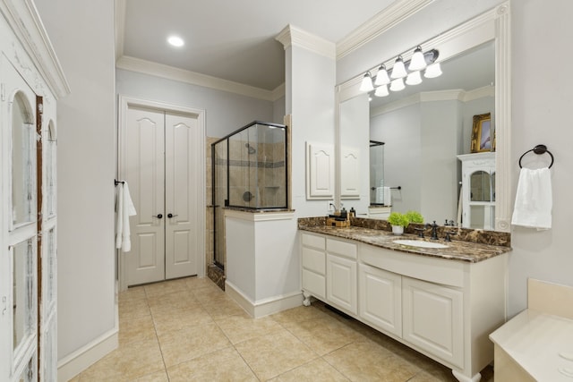 full bath featuring tile patterned flooring, crown molding, vanity, and a stall shower