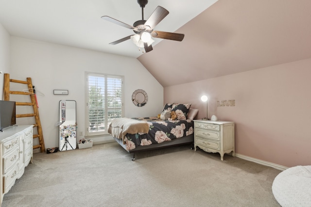 bedroom featuring light carpet, baseboards, ceiling fan, and vaulted ceiling