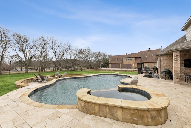 pool featuring a fire pit, a lawn, and a patio area