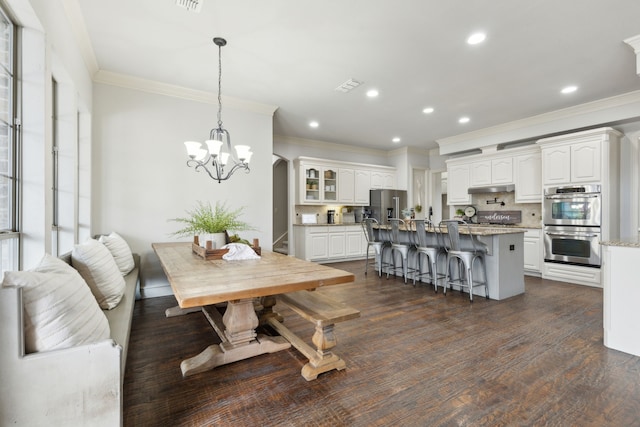 dining room with recessed lighting, visible vents, dark wood-type flooring, and ornamental molding