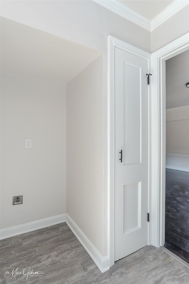interior space with wood finished floors and baseboards
