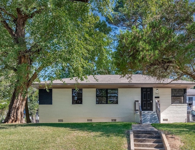 single story home featuring roof with shingles, brick siding, crawl space, and a front yard