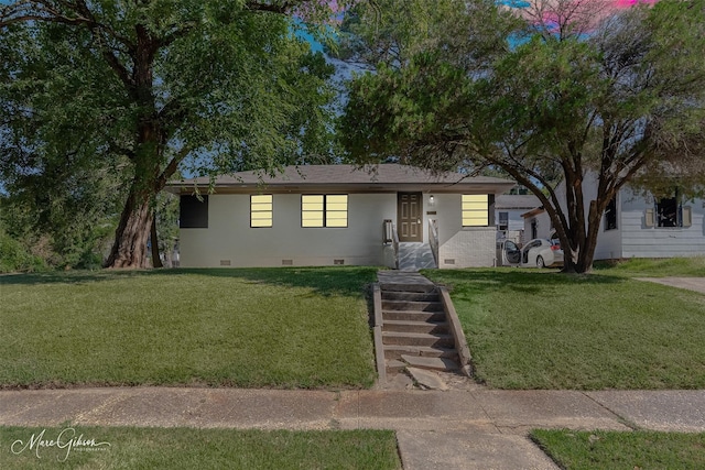 ranch-style house with a front lawn and crawl space