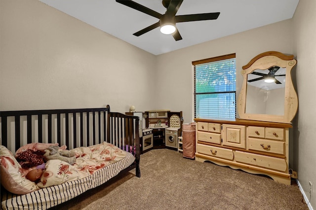 carpeted bedroom with ceiling fan and baseboards