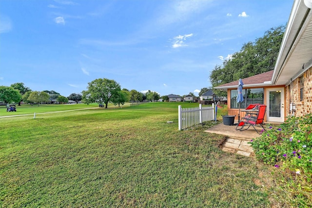 view of yard with a patio and fence