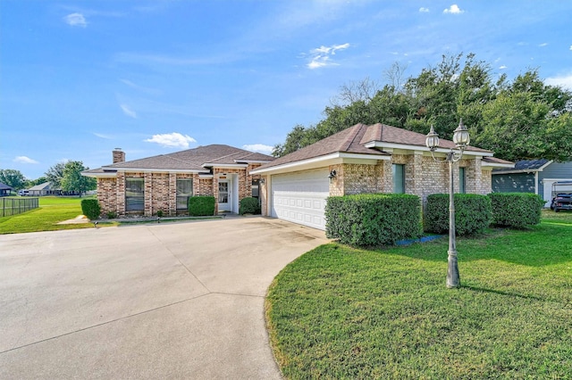 view of front facade with concrete driveway, a front lawn, an attached garage, and brick siding