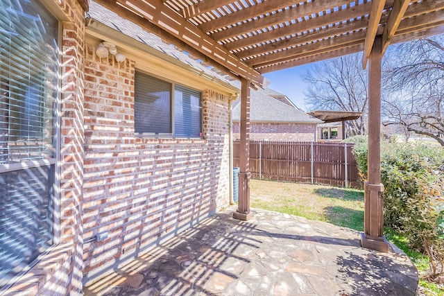 view of patio with fence and a pergola