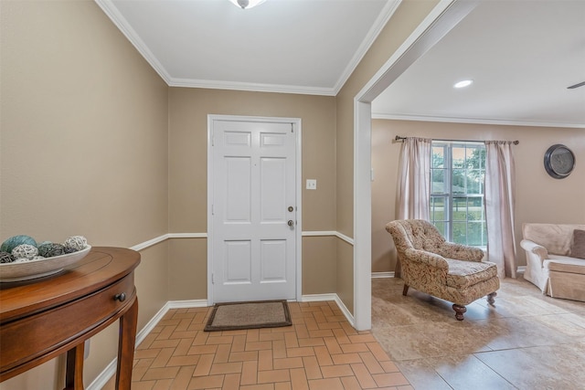 foyer entrance with crown molding and baseboards